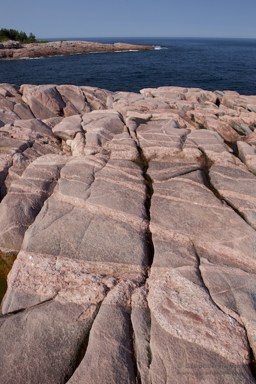 Northeast coast of Cape Breton with pink granite along the shore, Cape Breton Highlands National Park, Nova Scotia, CAN