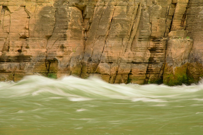 Wall of Tapeats Sandstone above rushing Colorado River, Grand Canyon National Park, AZ