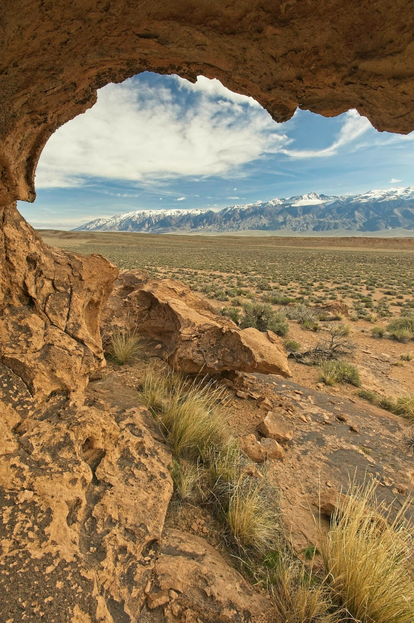 Northern White Mountains viewed through weathered tuff rock, Volcanic Tableland, Mono Co., CA
