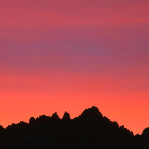 Mt. Whitney backlit by colorful sunset, as seen from Owens Valley, Eastern Sierra, CA